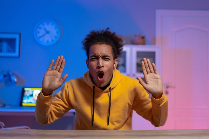 Young man yelling; 